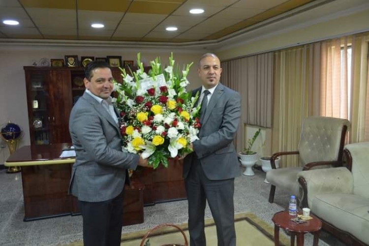 PRESENTING CONGRATULATION TO MR. GENERAL MANAGER OF AL-FAO GENERAL ENGINEERING COMPANY BY MR. GENERAL MANAGER OF ASHUR GENERAL COMPANY FOR CONSTRUCTION CONTRACTING